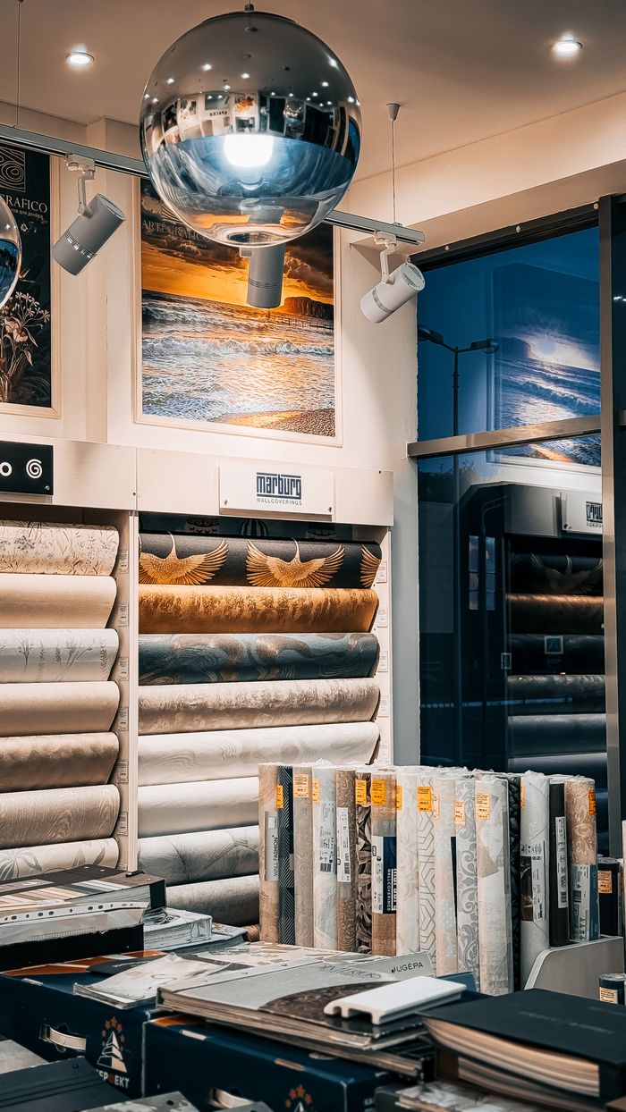 services-04 Modern showroom with diverse wallpaper designs and stylish lighting for elegant decor inspiration.