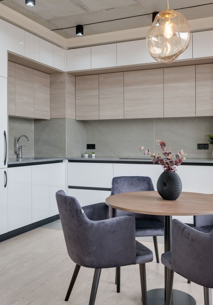 about-img Contemporary kitchen interior with sleek furniture and stylish lighting in a modern apartment.